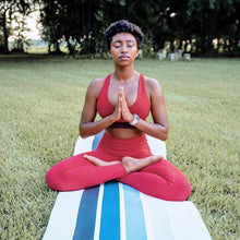Load image into Gallery viewer, black female on stripped yoga mat
