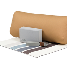 Load image into Gallery viewer, Gray yoga block on stripped mat with gray strap and brown bolster
