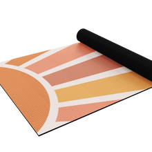 Load image into Gallery viewer, yoga mat with sun design half rolled up
