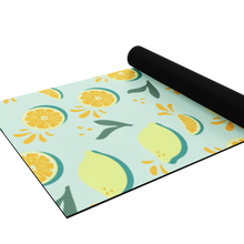 Load image into Gallery viewer, lemon yoga mat half rolled up
