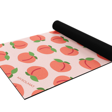 Load image into Gallery viewer, peach yoga mat half rolled up
